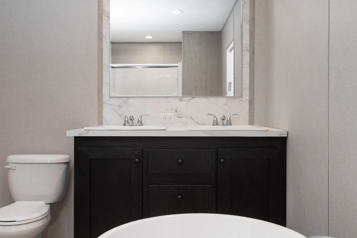 The THE THUNDERHEAD Primary Bathroom. This Manufactured Mobile Home features 3 bedrooms and 2 baths.