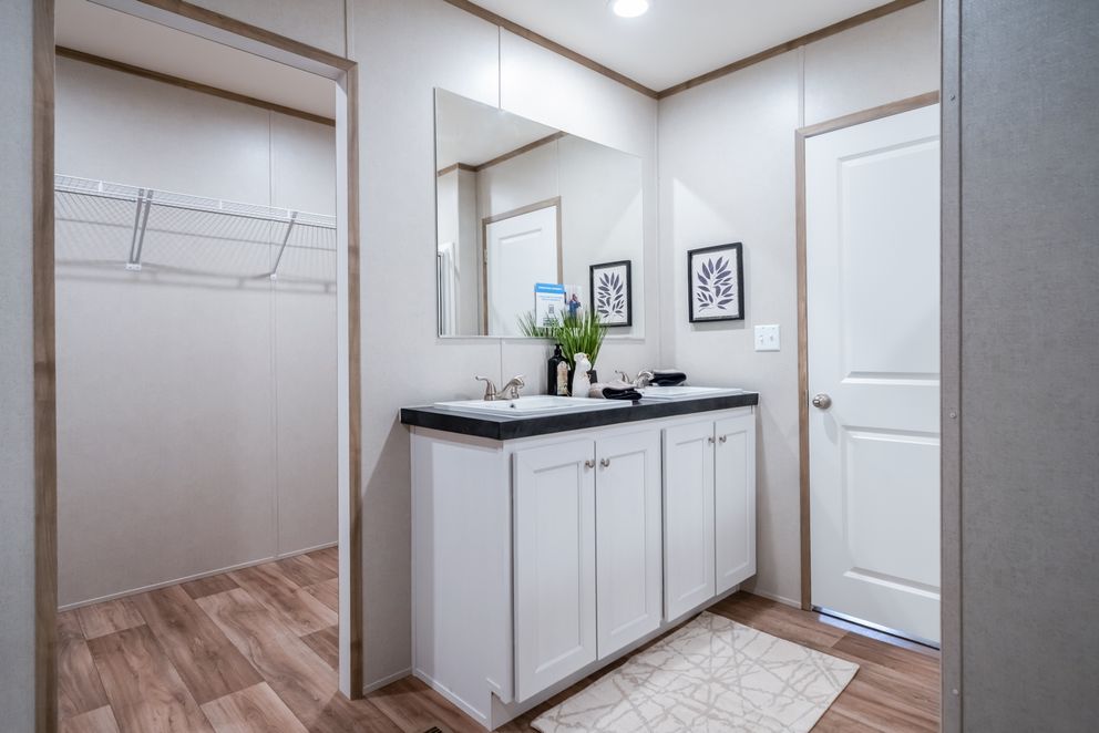 The ECLIPSE Primary Bathroom. This Manufactured Mobile Home features 4 bedrooms and 2 baths.