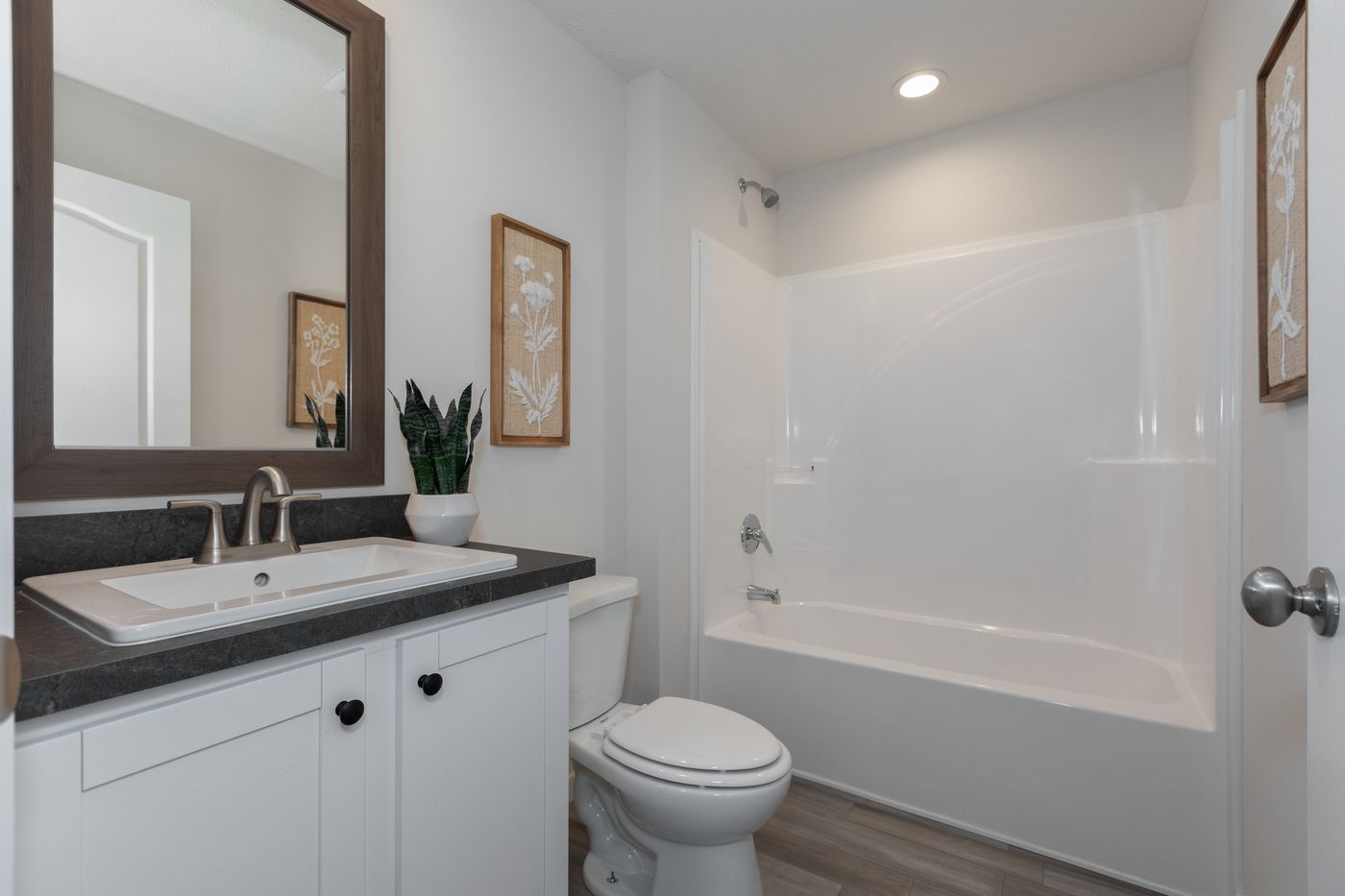The CENTER ST/5228-MS014-1 SECT Guest Bathroom. This Manufactured Mobile Home features 3 bedrooms and 2 baths.