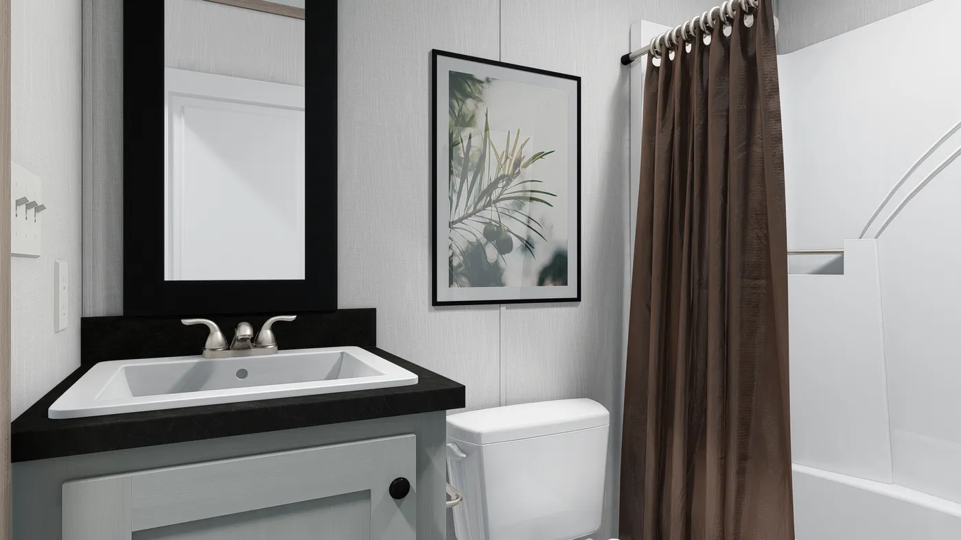 The 6616-4711 THE PULSE Guest Bathroom. This Manufactured Mobile Home features 3 bedrooms and 2 baths.