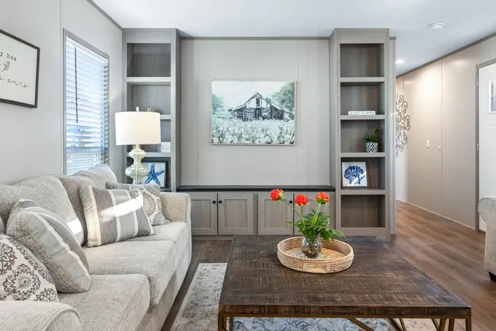 The RESOLUTION 16763X Living Room. This Manufactured Mobile Home features 3 bedrooms and 2 baths.