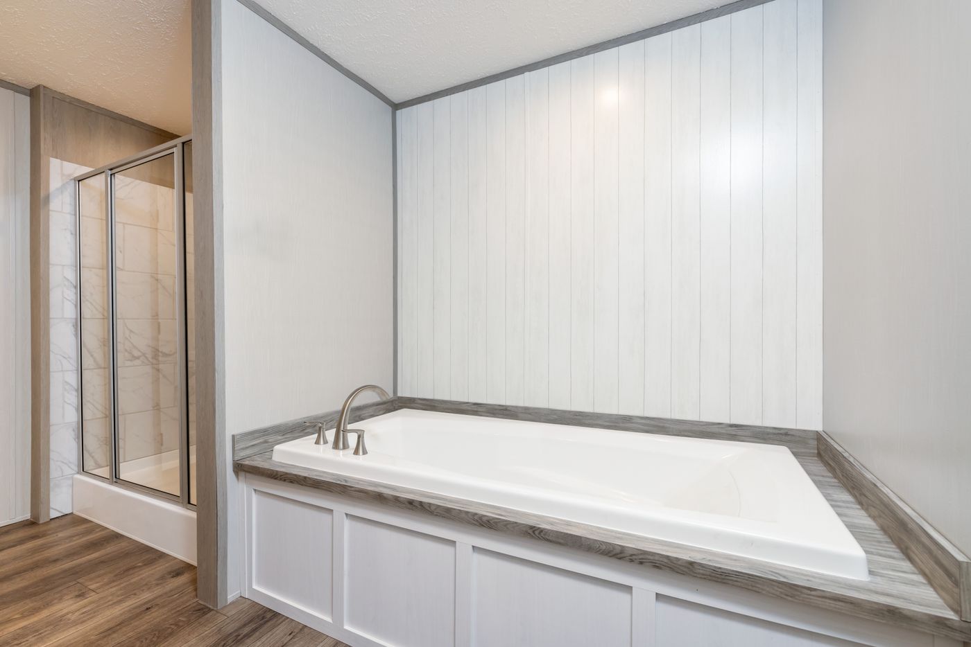 The FARM HOUSE 72 Primary Bathroom. This Manufactured Mobile Home features 4 bedrooms and 2 baths.