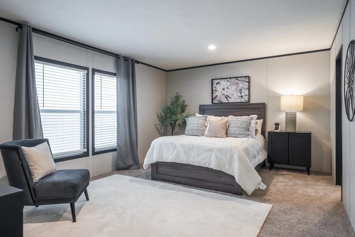 The ABSOLUTE VALUE Primary Bedroom. This Manufactured Mobile Home features 4 bedrooms and 2 baths.