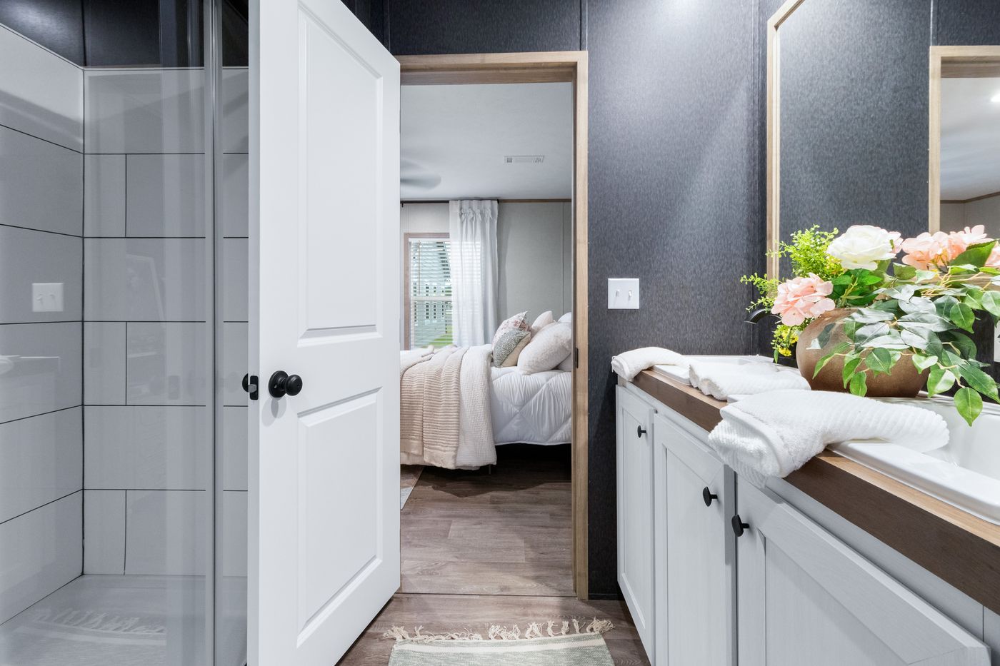 The EL SUENO BREEZE Primary Bathroom. This Manufactured Mobile Home features 4 bedrooms and 2 baths.