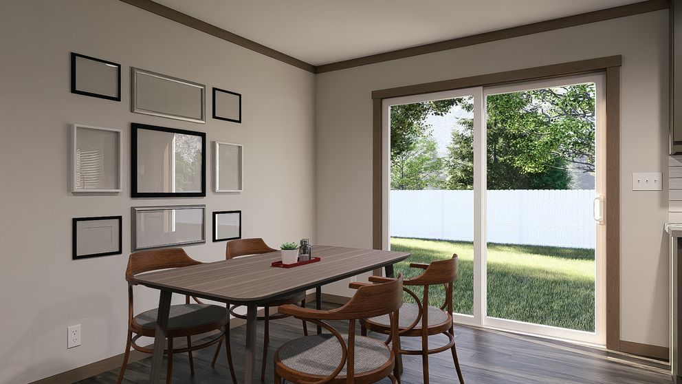 The EMILIE ELITE Dining Area. This Manufactured Mobile Home features 3 bedrooms and 2 baths.