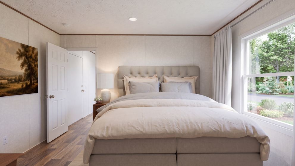 The CYPRESS Primary Bedroom. This Manufactured Mobile Home features 4 bedrooms and 2 baths.