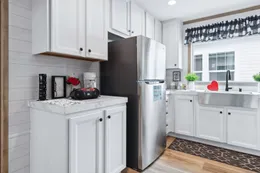 The THE REAL DEAL Kitchen. This Manufactured Mobile Home features 3 bedrooms and 2 baths.