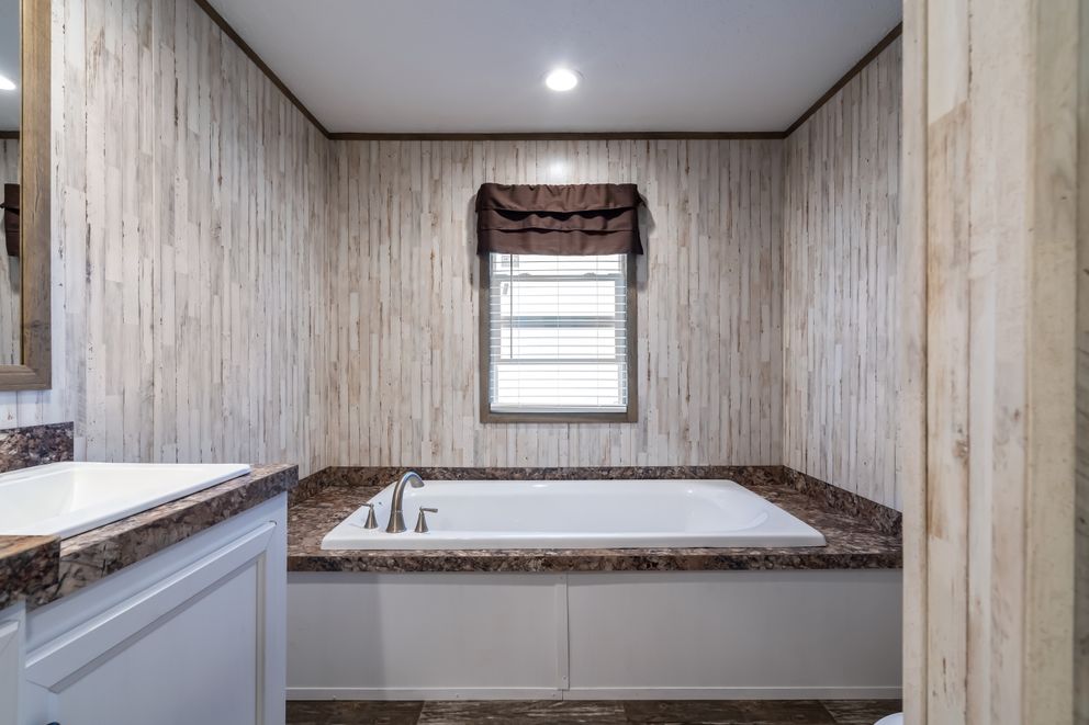 The NUMBER ONE Exterior. This Manufactured Mobile Home features 3 bedrooms and 2 baths.