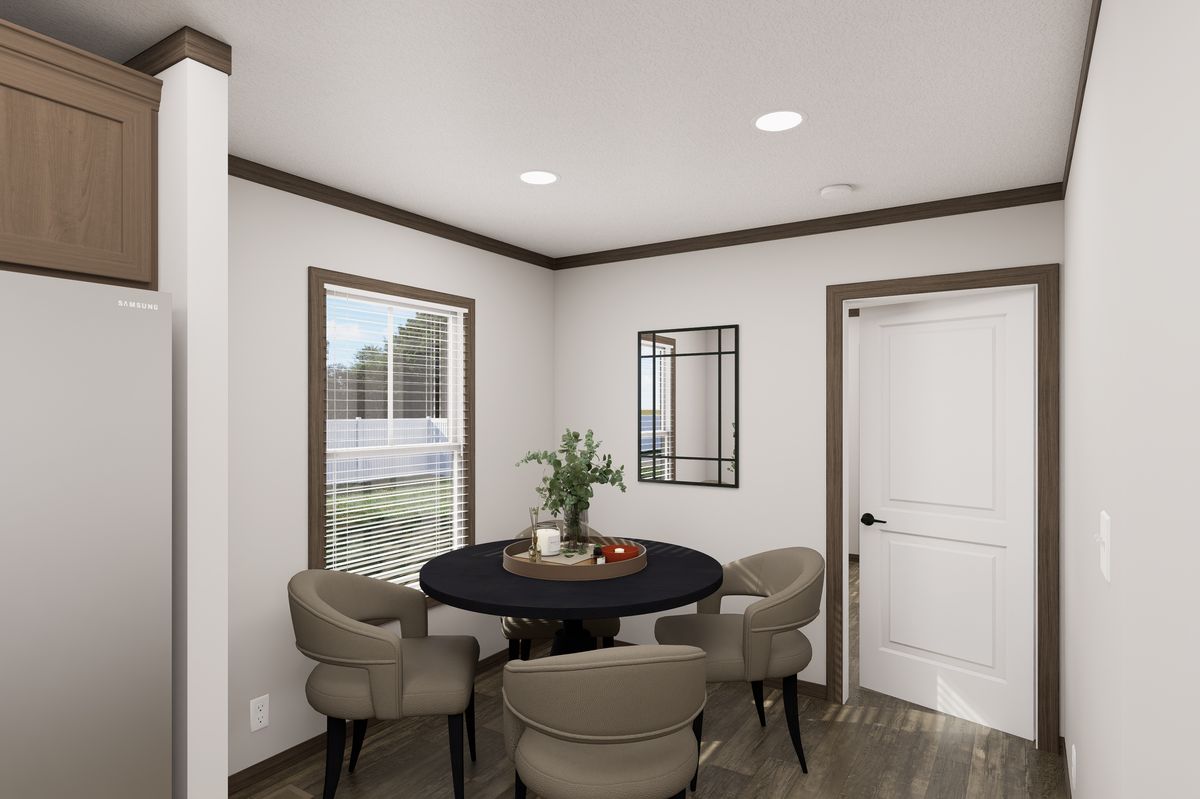 The THE TRUMAN Dining Area. This Manufactured Mobile Home features 3 bedrooms and 2 baths.