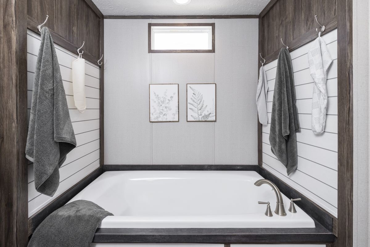 The THE SURE THING Primary Bathroom. This Manufactured Mobile Home features 3 bedrooms and 2 baths.