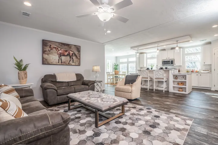 The THE HEWITT Living Room. This Manufactured Mobile Home features 4 bedrooms and 3 baths.