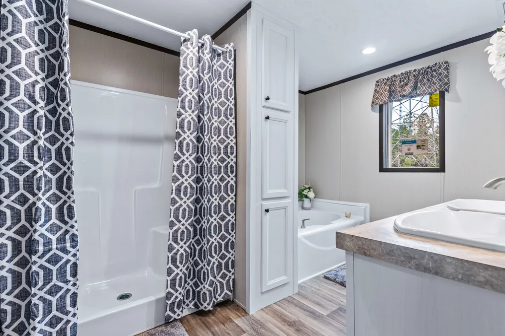 The THE GRAND Primary Bathroom. This Manufactured Mobile Home features 3 bedrooms and 2 baths.