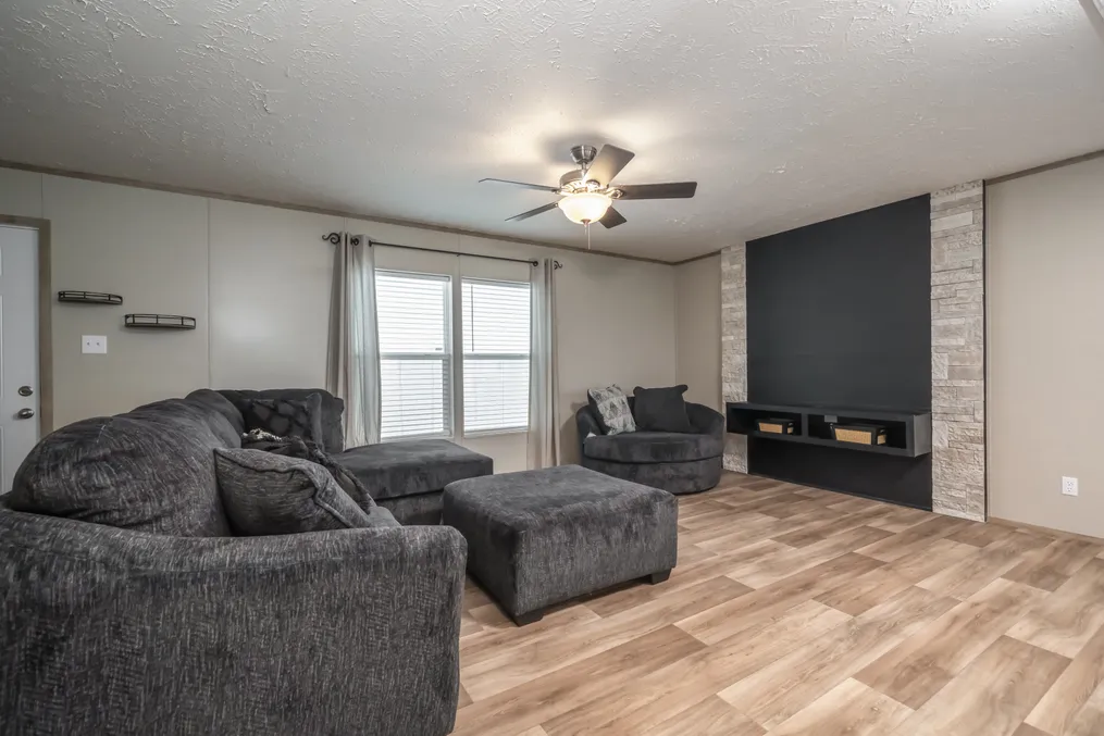 The TRADITION 72 Living Room. This Manufactured Mobile Home features 4 bedrooms and 2 baths.