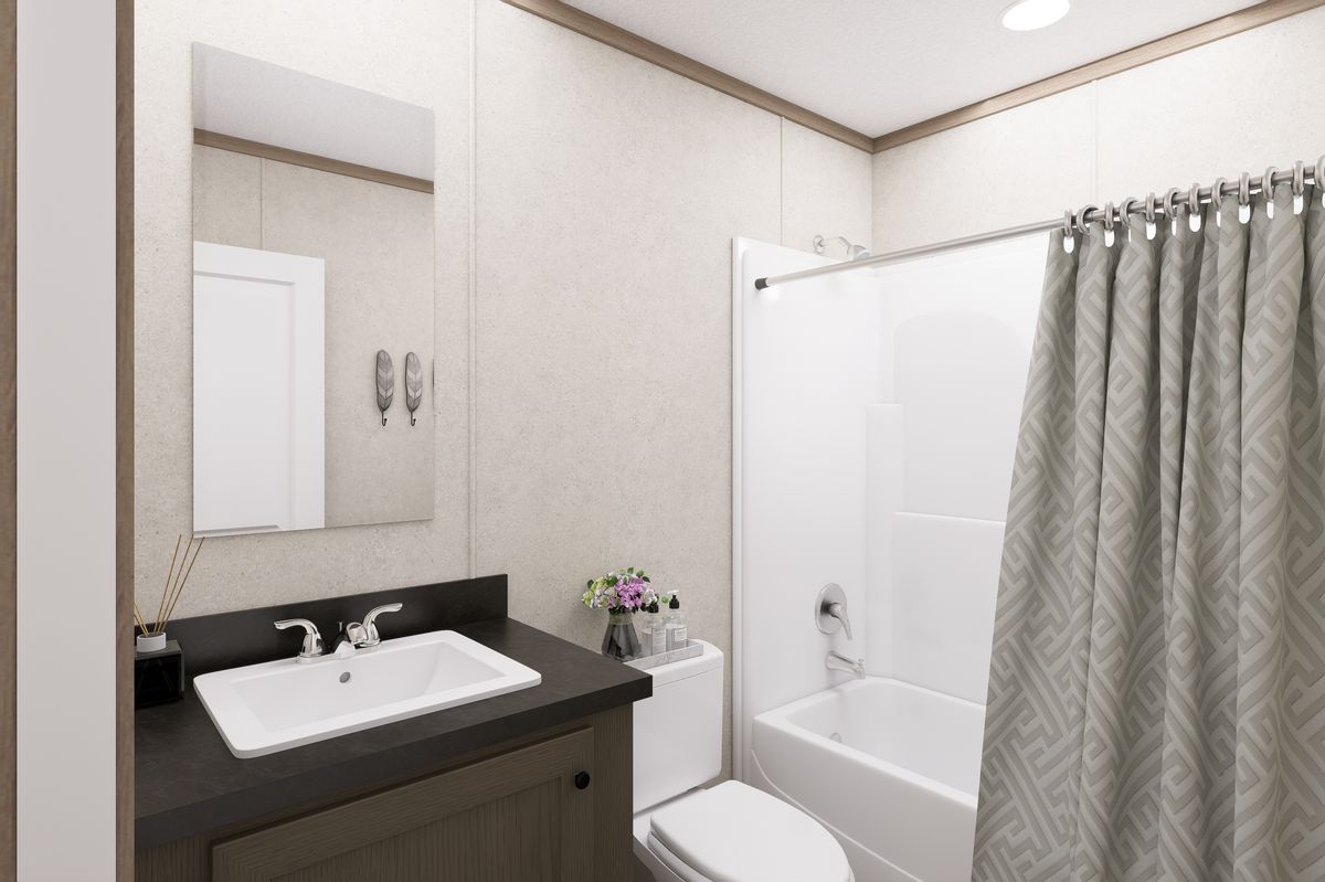 The 6616-CC01 CORNERSTONE 66 Guest Bathroom. This Manufactured Mobile Home features 3 bedrooms and 2 baths.
