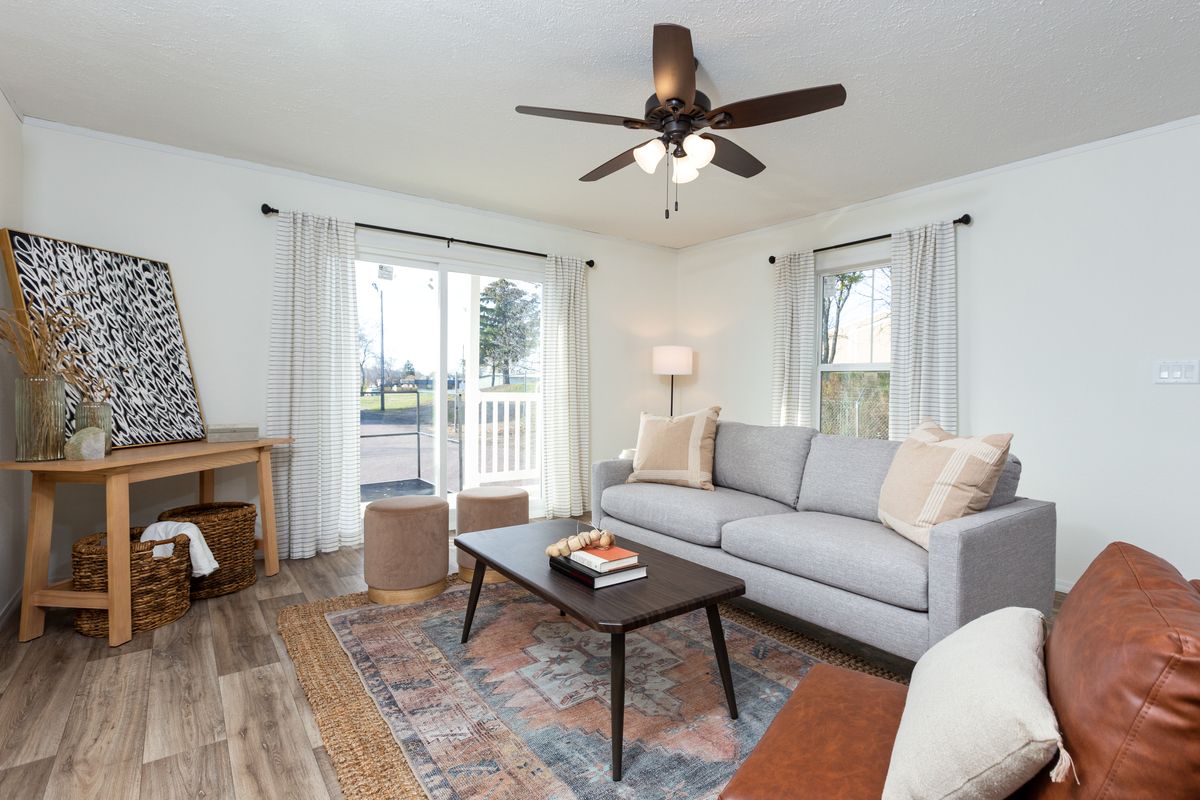 The LIFESTYLE 208 Living Room. This Manufactured Mobile Home features 3 bedrooms and 2 baths.