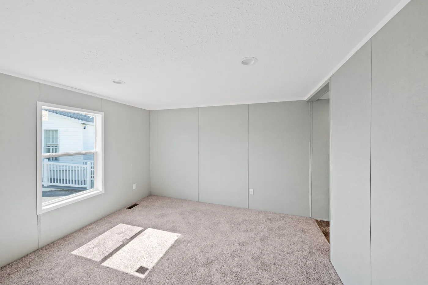 The ZIRCON Primary Bedroom. This Manufactured Mobile Home features 3 bedrooms and 2 baths.