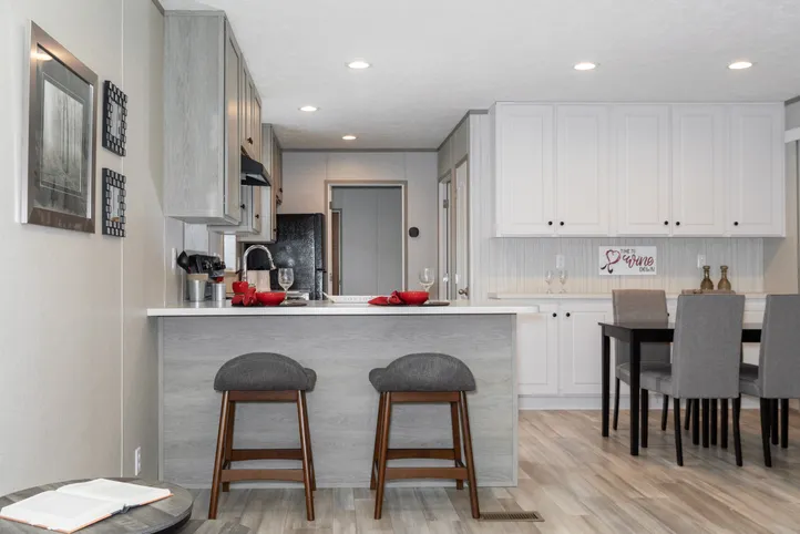 The THE ANNIVERSARY 76 Kitchen. This Manufactured Mobile Home features 3 bedrooms and 2 baths.