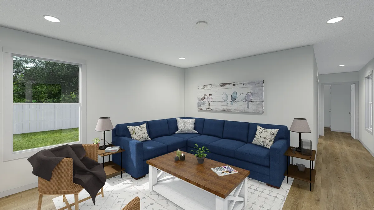The MOVE ON UP Living Room. This Manufactured Mobile Home features 3 bedrooms and 2 baths.