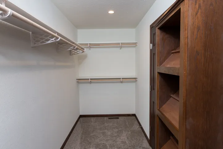 The LEGEND 86 Primary Bedroom. This Manufactured Mobile Home features 3 bedrooms and 2 baths.