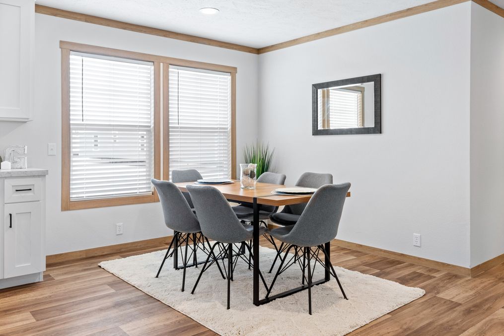 The HARPER Dining Area. This Manufactured Mobile Home features 3 bedrooms and 2 baths.