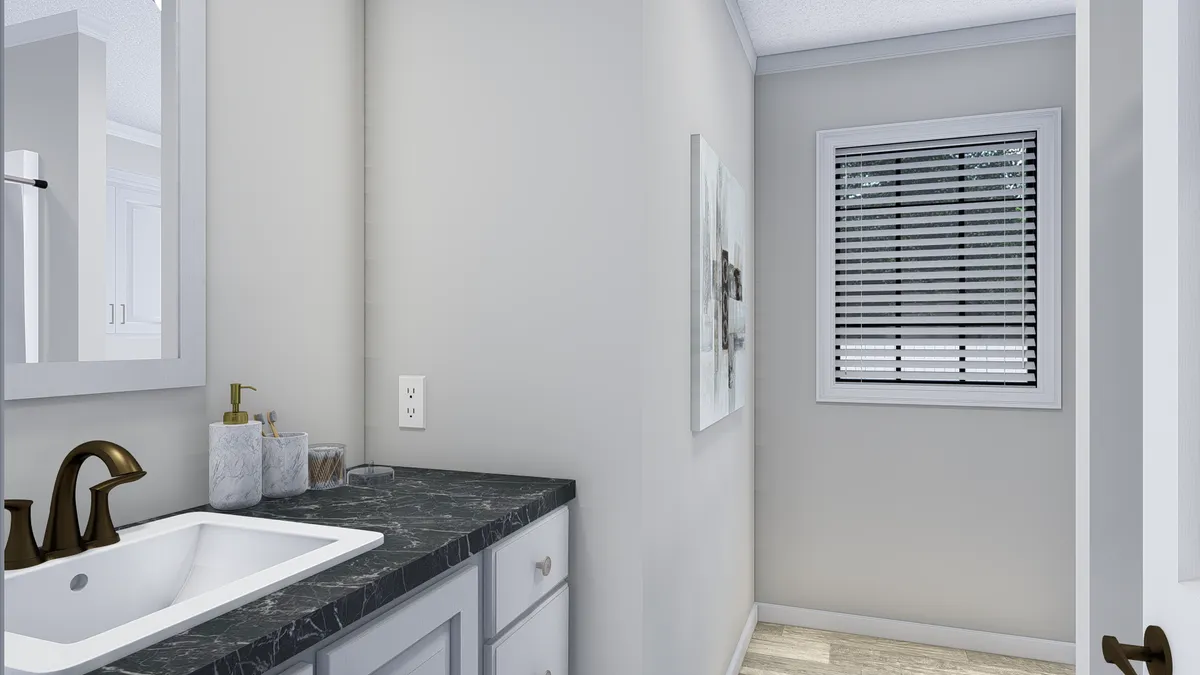 The THE BIG EASY Guest Bathroom. This Manufactured Mobile Home features 4 bedrooms and 3 baths.