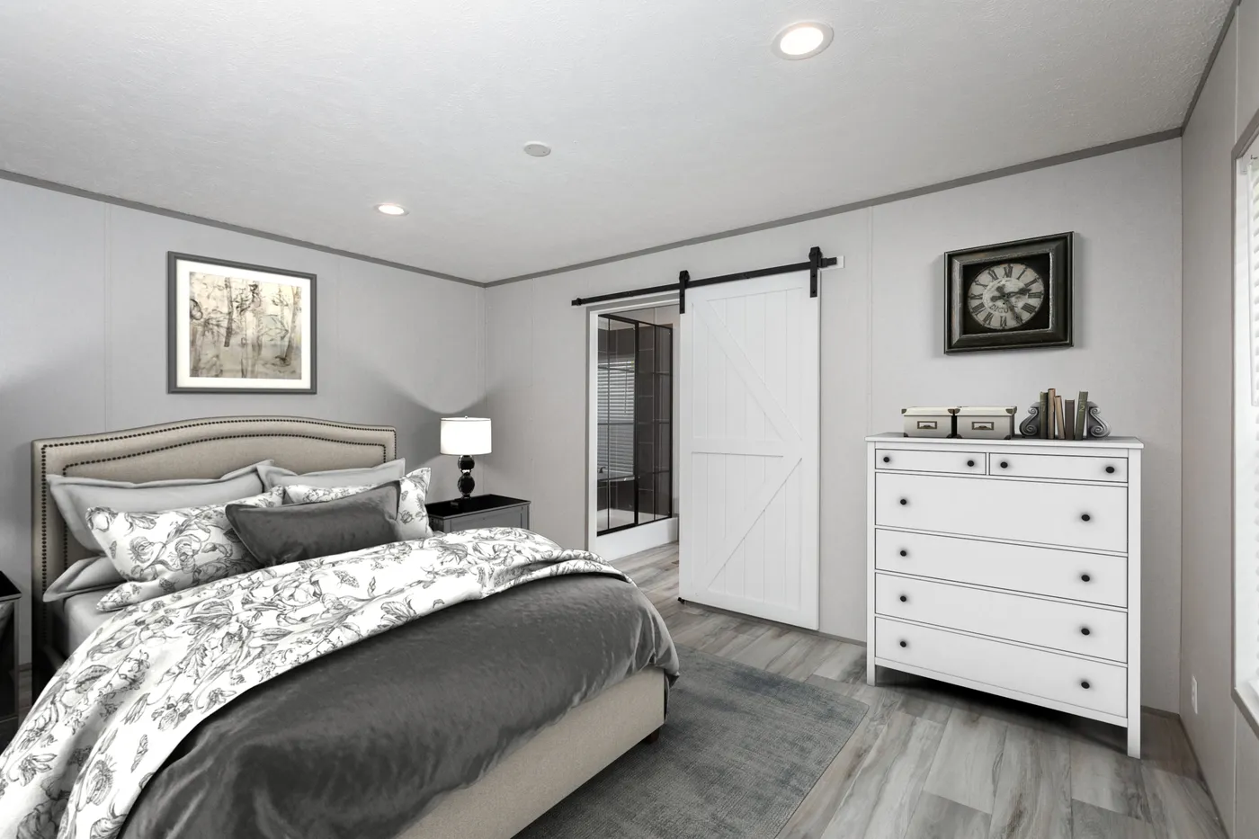 The PLATINUM ANNIVERSARY Primary Bedroom. This Manufactured Mobile Home features 3 bedrooms and 2 baths.