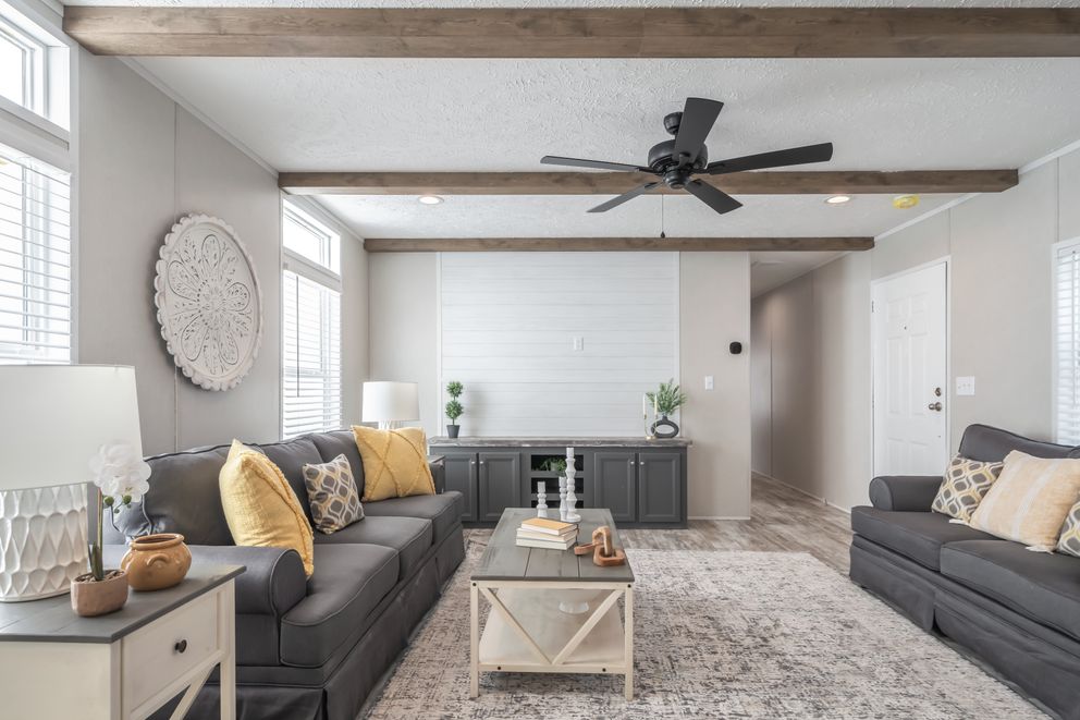 The ANNIVERSARY CHOICE Living Room. This Manufactured Mobile Home features 3 bedrooms and 2 baths.