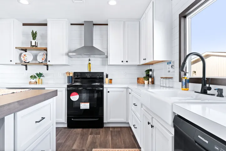 The BREEZE FARMHOUSE Kitchen. This Manufactured Mobile Home features 3 bedrooms and 2 baths.