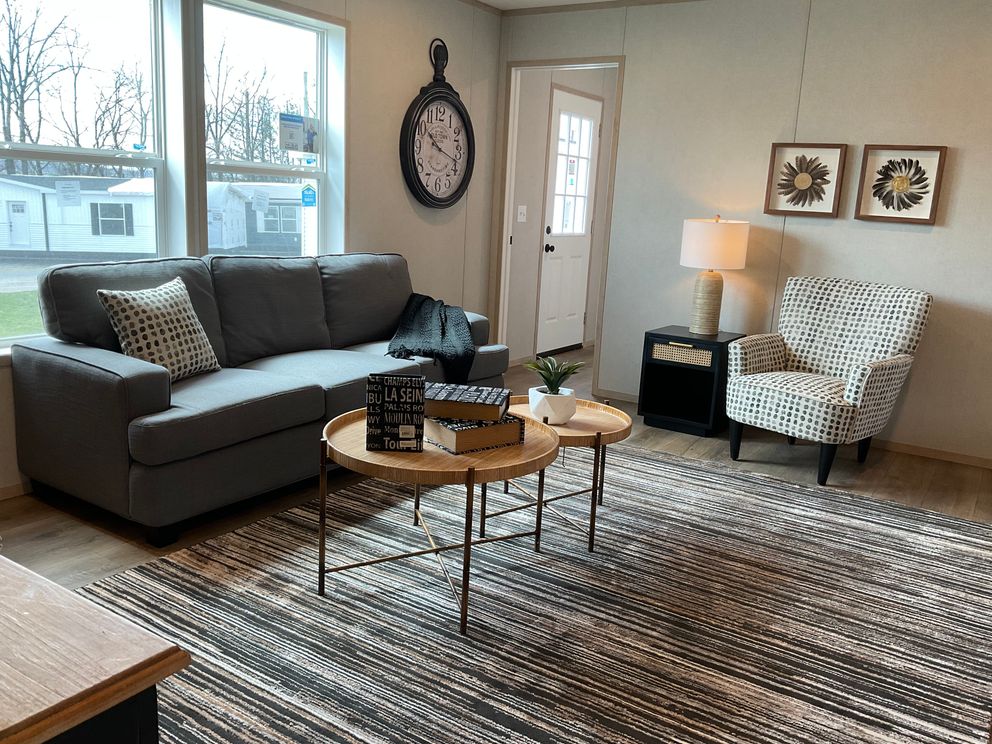 The EMERALD 7228-643 Living Room. This Manufactured Mobile Home features 4 bedrooms and 2 baths.