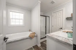 The THE DEWEY Primary Bathroom. This Manufactured Mobile Home features 3 bedrooms and 2 baths.