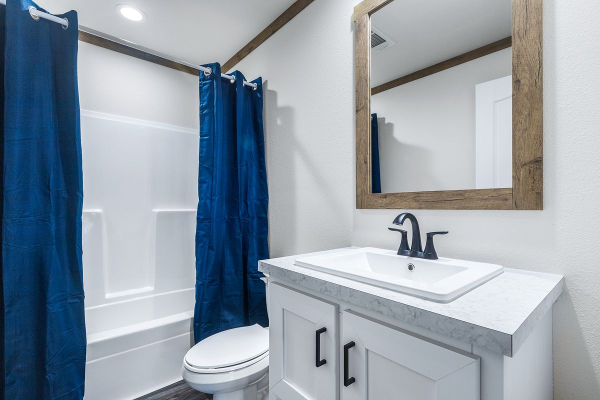 The LIZZIE Guest Bathroom. This Manufactured Mobile Home features 3 bedrooms and 2 baths.
