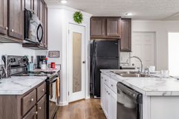 The SUNDANCE 48B Kitchen. This Manufactured Mobile Home features 3 bedrooms and 2 baths.