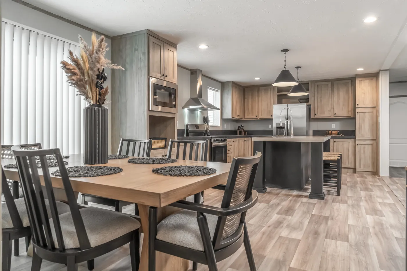 The TRADITION 72 Dining Room. This Manufactured Mobile Home features 3 bedrooms and 2 baths.