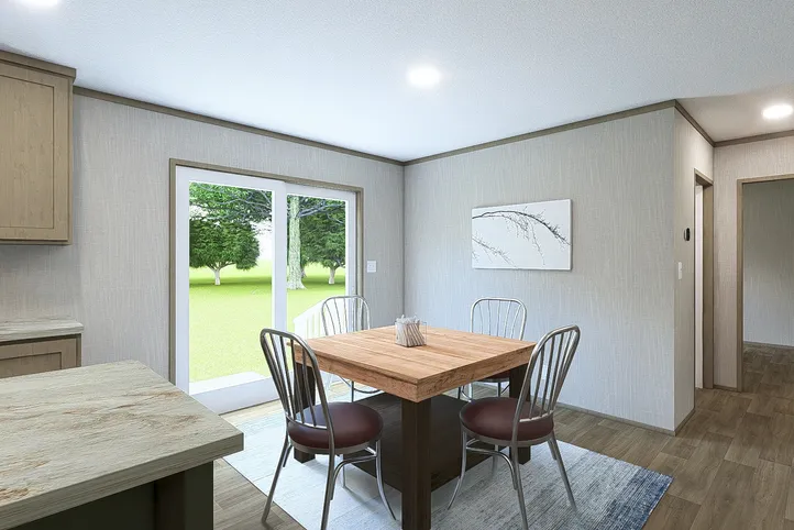 The RIO Dining Area. This Manufactured Mobile Home features 3 bedrooms and 2 baths.