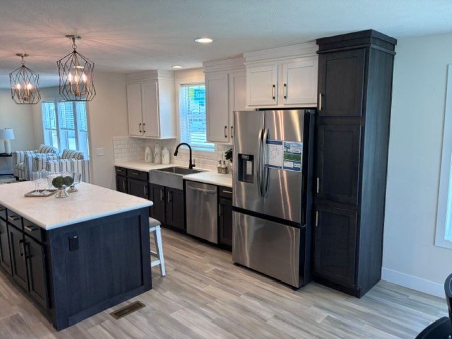 The PIONEER ST 6030-MS064 SECT Kitchen. This Manufactured Mobile Home features 3 bedrooms and 2 baths.