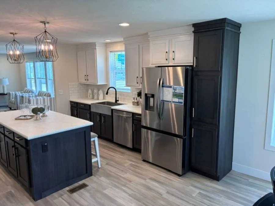 The PIONEER ST 6030-MS064 SECT Kitchen. This Manufactured Mobile Home features 3 bedrooms and 2 baths.