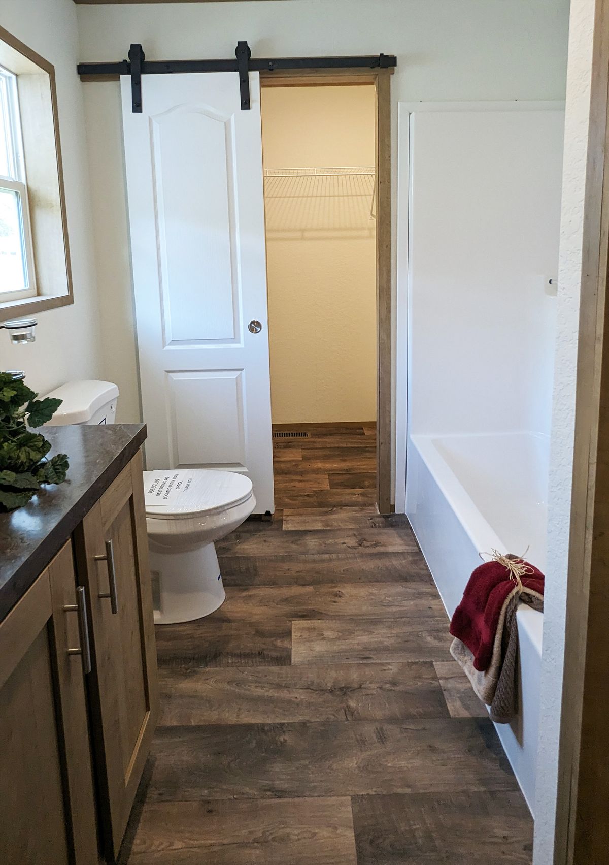 The LIFESTYLE 65-2 Primary Bathroom. This Manufactured Mobile Home features 3 bedrooms and 2 baths.