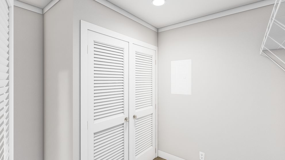 The LET IT BE Utility Room. This Manufactured Mobile Home features 3 bedrooms and 2 baths.