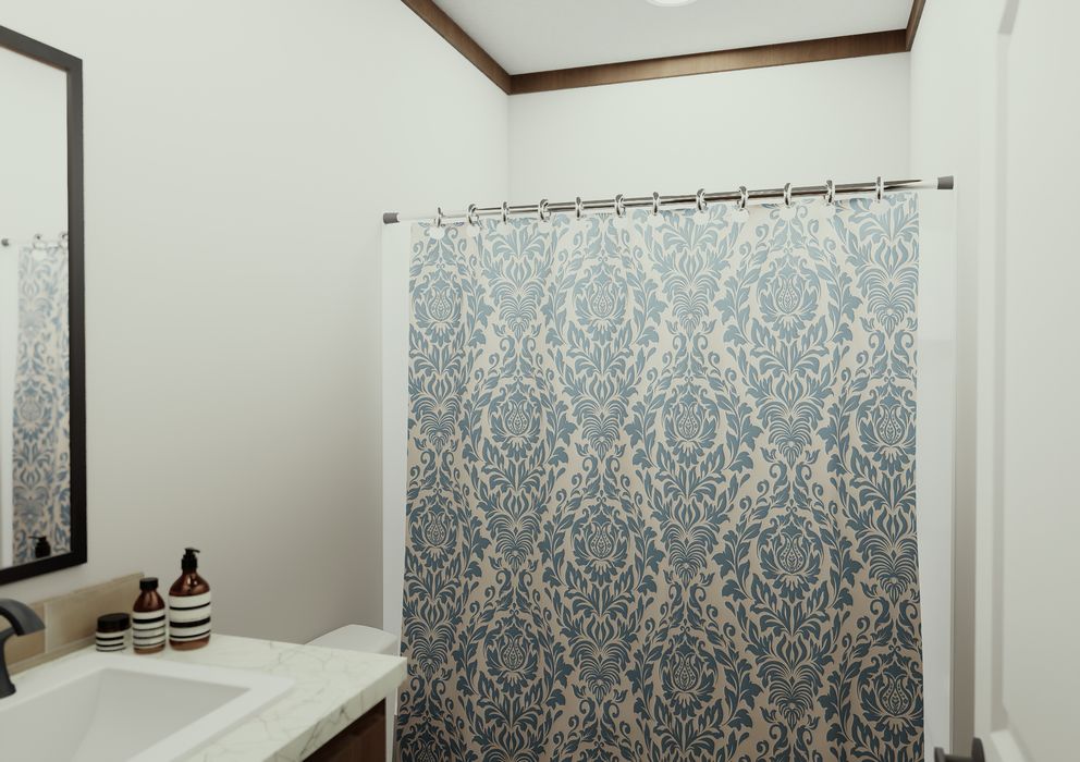 The THE ELITE Guest Bathroom. This Manufactured Mobile Home features 3 bedrooms and 2 baths.