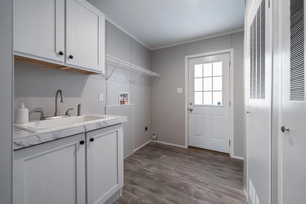 The THE FUSION 68 Utility Room. This Manufactured Mobile Home features 3 bedrooms and 2 baths.