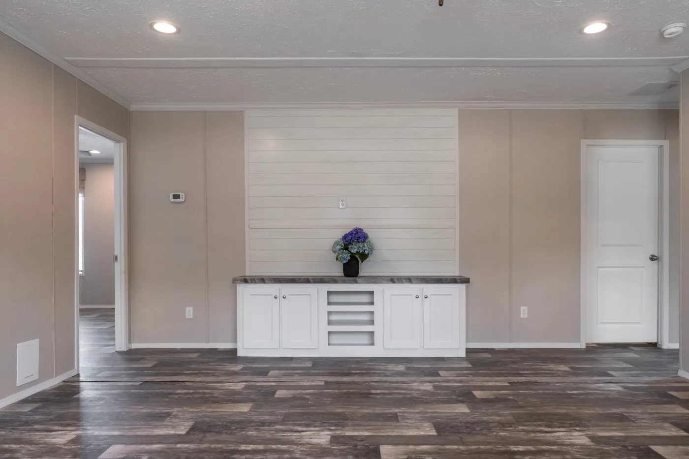 The NORTHSHORE Living Room. This Manufactured Mobile Home features 3 bedrooms and 2 baths.