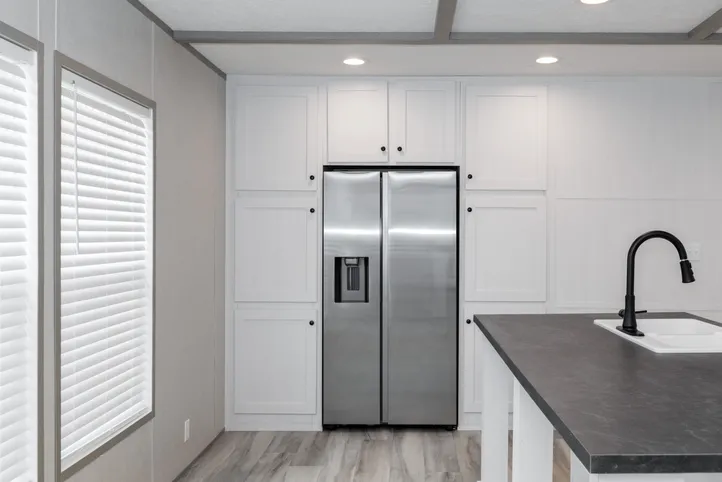 The PLATINUM ANNIVERSARY Kitchen. This Manufactured Mobile Home features 3 bedrooms and 2 baths.