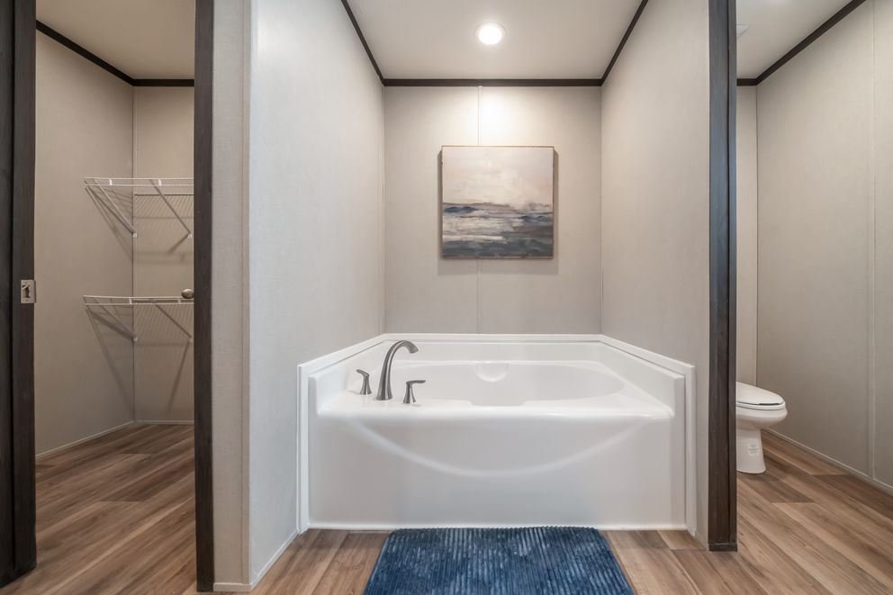 The DYNAMIC Primary Bathroom. This Manufactured Mobile Home features 3 bedrooms and 2 baths.