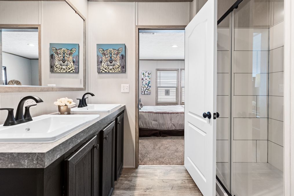 The CRAZY EIGHTS Primary Bathroom. This Manufactured Mobile Home features 4 bedrooms and 2 baths.