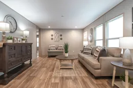 The RAINIER Living Room. This Manufactured Mobile Home features 4 bedrooms and 3 baths.