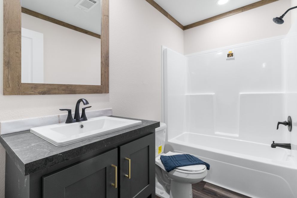 The FARM 4 FLEX Guest Bathroom. This Manufactured Mobile Home features 4 bedrooms and 3 baths.