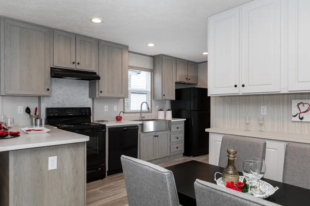 The THE ANNIVERSARY 76 Kitchen. This Manufactured Mobile Home features 3 bedrooms and 2 baths.