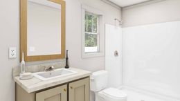 The RHYTHM NATION Primary Bathroom. This Manufactured Mobile Home features 3 bedrooms and 2 baths.
