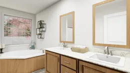 The DRM711F 71'              DREAM Primary Bathroom. This Manufactured Mobile Home features 5 bedrooms and 3 baths.