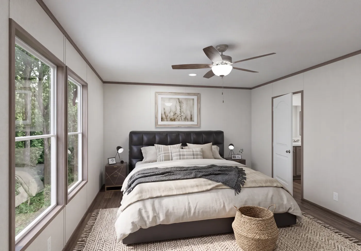 The THE MOUNTAINEER 64 Primary Bedroom. This Manufactured Mobile Home features 3 bedrooms and 2 baths.